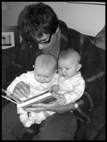 Daddy reading to Dinah and Djuna